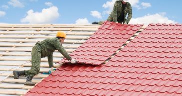 Two,Workers,On,Roof,At,Works,With,Metal,Tile,And