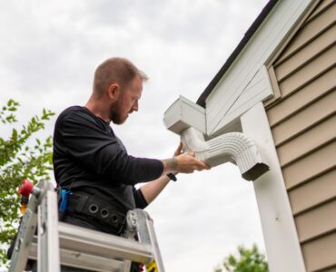 person installing new gutter